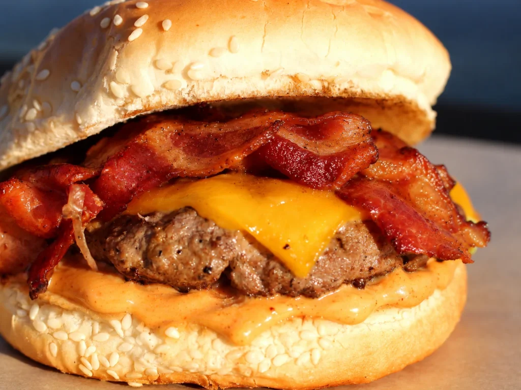 Mambo Bacon Cheeseburger with cheddar cheese, smoked bacon, and Mambo Fry Sauce.