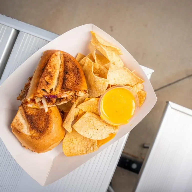 Mambo Cuban sandwich served with tortilla chips and dipping sauce.