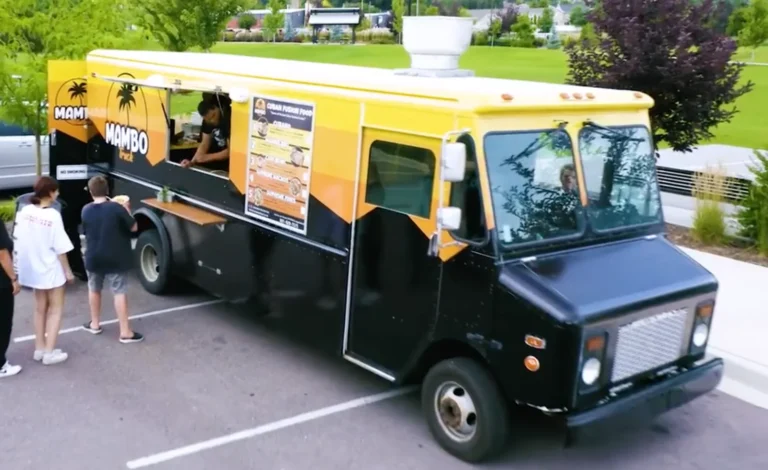 Mambo food truck serving guests at an outdoor event.